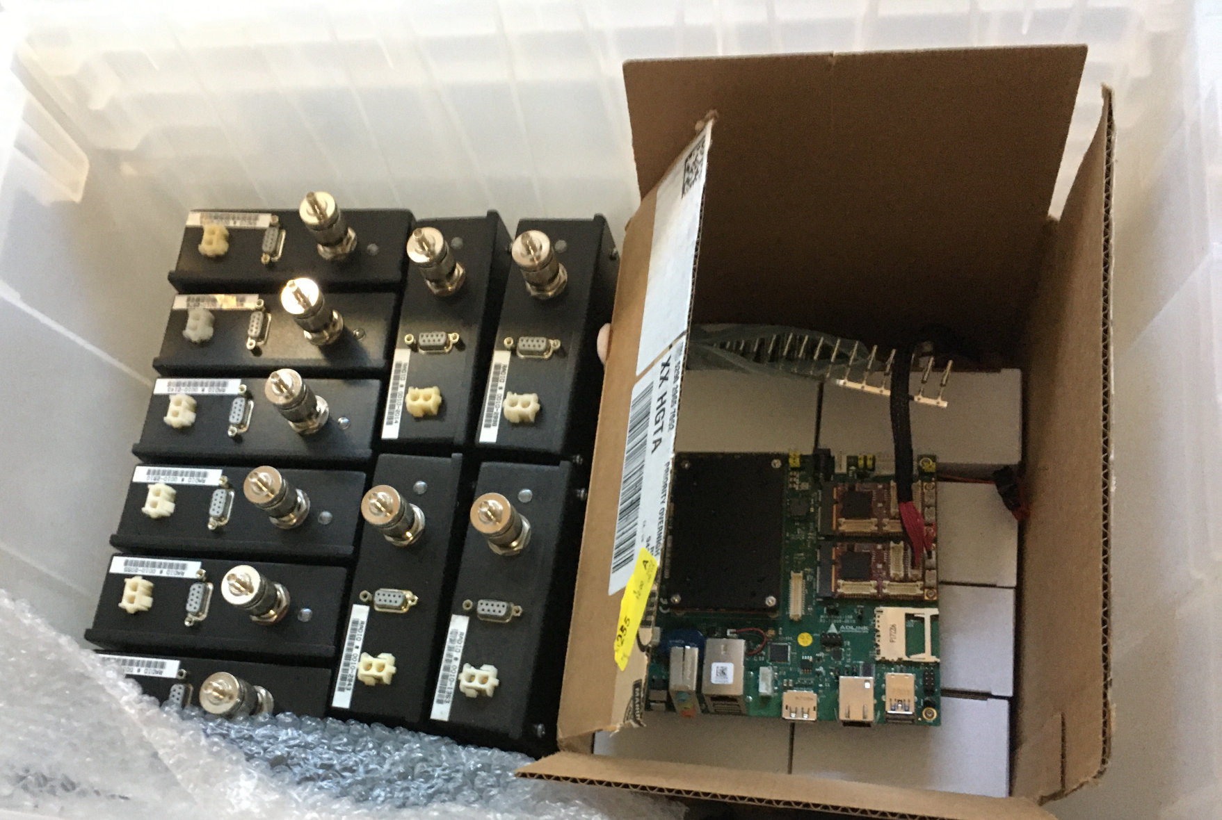 Moving box stuffed with Ricochet modems, power supplies, and a Adlink carrier board.
