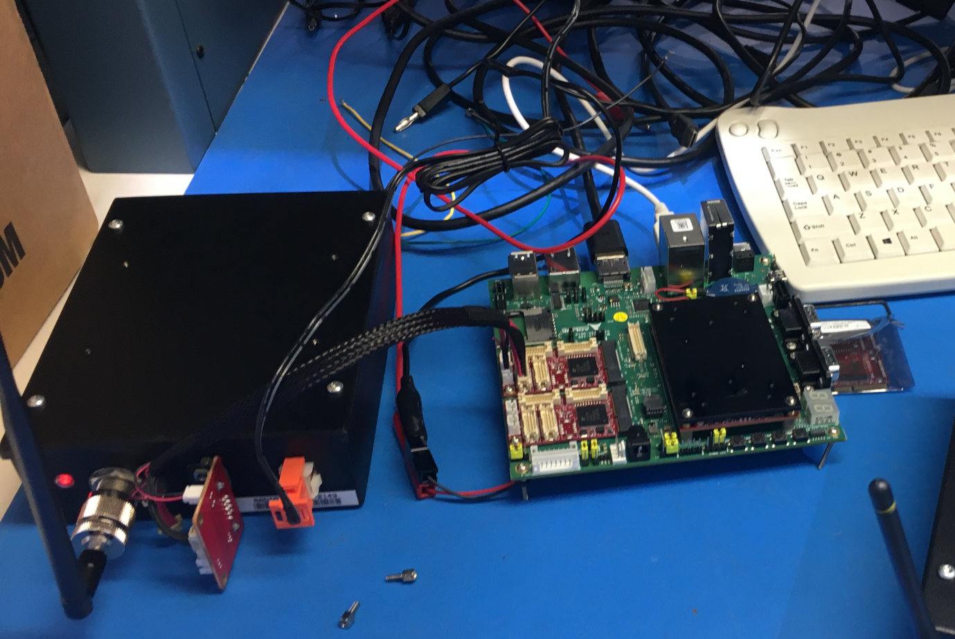 ICR-900 modem connected to Adlink carrier board and Osprey on test bench.